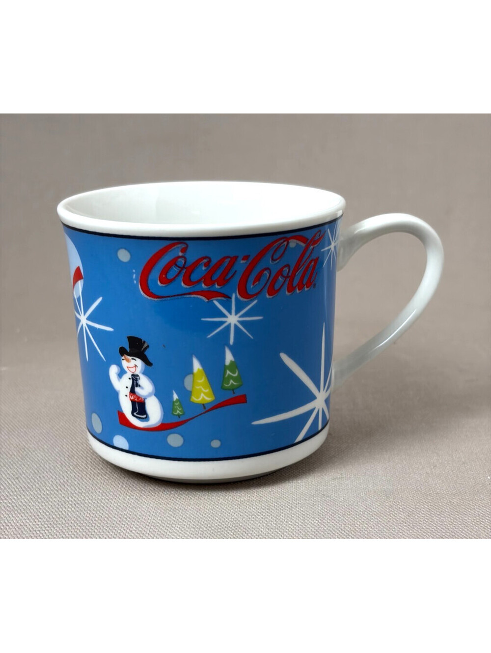 Coca Cola Laughing Snowman Coffee Mug Blue Christmas Retro Starburst Cup 10oz